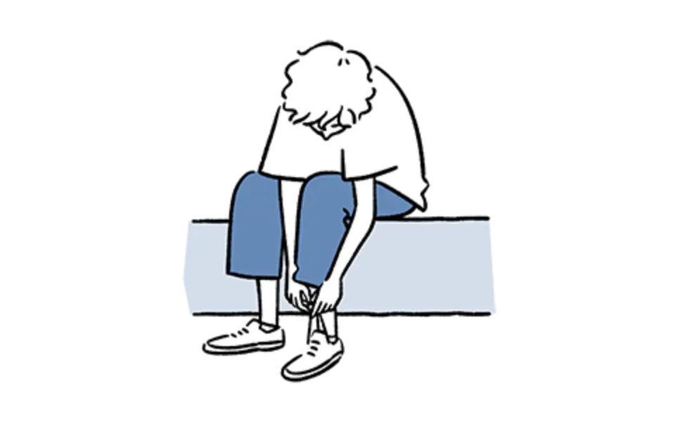 玄関で靴を履く人のイラスト